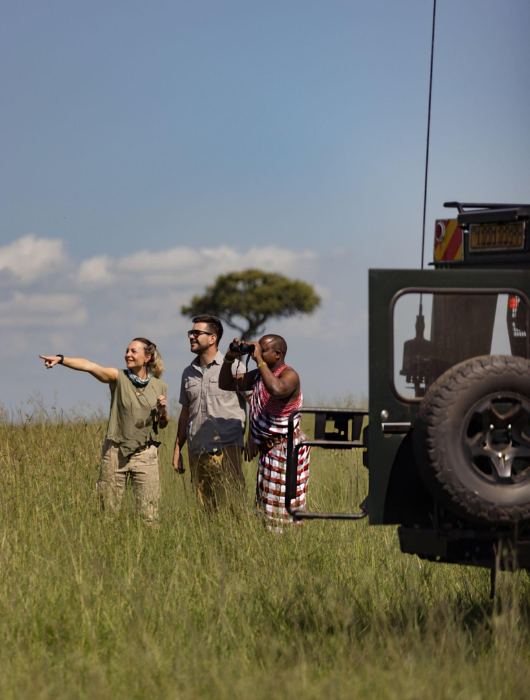 Safari guide planning a journey with travelers in Africa